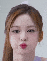 a close up of a girl making a face with her mouth open