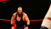 two wrestlers in a wrestling ring with one wearing a ko belt