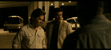 two men are standing next to each other and one of them is saying " great "