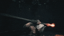 a person with white hair is holding a sword that is glowing red