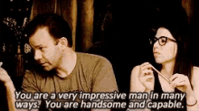a man and a woman are sitting next to each other and the man is saying you are a very impressive man