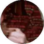 a blurred image of a person 's face in a circle .