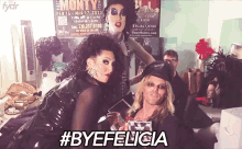 two drag queens pose in front of a poster for monty 's