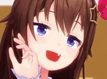 a close up of a girl with a star on her hair