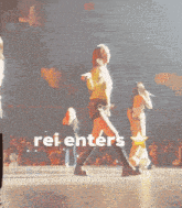 a woman is dancing on a stage with the words rei enters written on the bottom