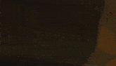 a painting of a man standing in front of a large fireball