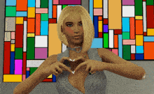a woman making a heart shape with her hands