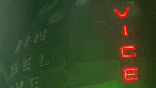 a green sign with red letters that says vince on it