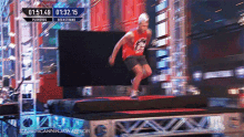 a man is jumping on a trampoline with the time of 01:51:49 on the screen