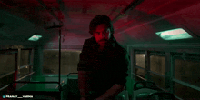 a man holding a gun in a dark room with the hashtag pranay_varma on the bottom