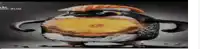 a cartoon of a penguin eating a hamburger with cheese