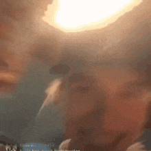 a blurry picture of a person 's face with the words hydrowator in the corner