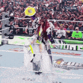 a wrestler in a ring with a sign that says tiffanyluv24