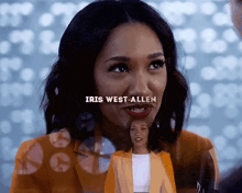 a close up of a woman with the name iris west allen on her face