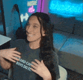 a woman wearing a t-shirt that says " my hard can boys do it "