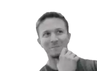 a man in a black shirt holds his finger to his mouth