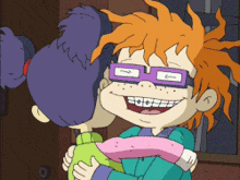 a cartoon character wearing glasses and braces is hugging a girl