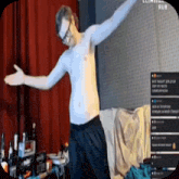 a shirtless man with glasses is dancing in a living room .
