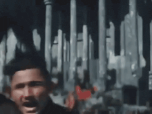a man is screaming in front of a group of people in a crowd .