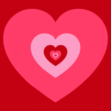 a pink heart with red hearts in it