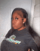 a woman with long hair is wearing a black shirt that says celebrity content 3