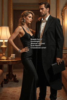 a woman in a black dress stands next to a man in a suit