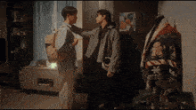 a man with a backpack stands next to another man