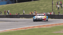 a race car with the number 6 on the front is on a track