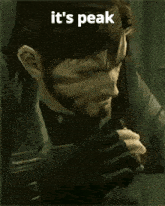 a man with a beard has the words it 's peak written on his face