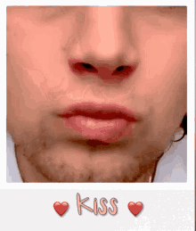 a close up of a man 's face with the words kiss written on the bottom