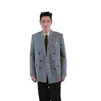 a man in a suit and tie spreads his arms out