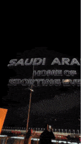 a sign that says ' saudi arabia home of ' on it