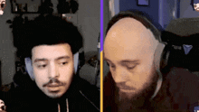 a man with a beard and headphones looks at the camera