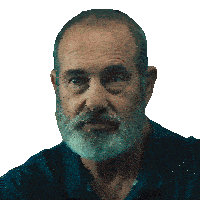 a man with a beard and a blue shirt is looking at the camera