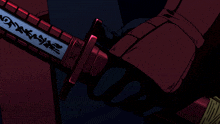 a person is holding a sword with chinese writing on the blade