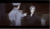 a man pointing at another man with a bandaged face