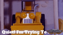 a toy bulldozer with the words quiet i 'm trying to