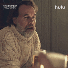 an advertisement for nine perfect strangers shows a man pointing