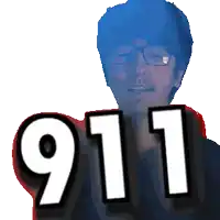 a man wearing glasses holds up the number 911 in front of his face