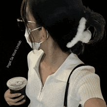 a woman wearing a mask is holding a cup of coffee and the words inget sa work unilab are below her