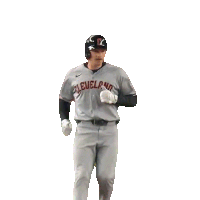 a baseball player for the cleveland indians is standing on the field