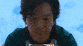 a close up of a person 's face with a picture of a person on it