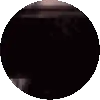 a circle with a blurred image of a person 's face