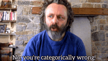 a man with a beard and a blue shirt says no you 're categorically wrong