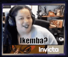 a woman wearing headphones says ikemba