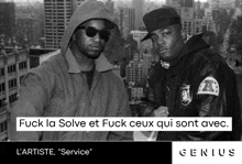 two men standing next to each other with the words fuck la solve et fuck ceux qui sont avec
