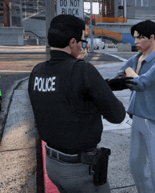 a police officer talking to a man in front of a sign that says do not block