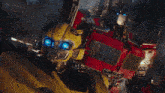 bumblebee and optimus prime from the movie transformers are standing next to each other
