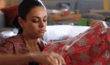 mila kunis a bad moms christmas wrapped presents done whatever