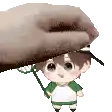 a hand is holding a little boy with a badminton racket .